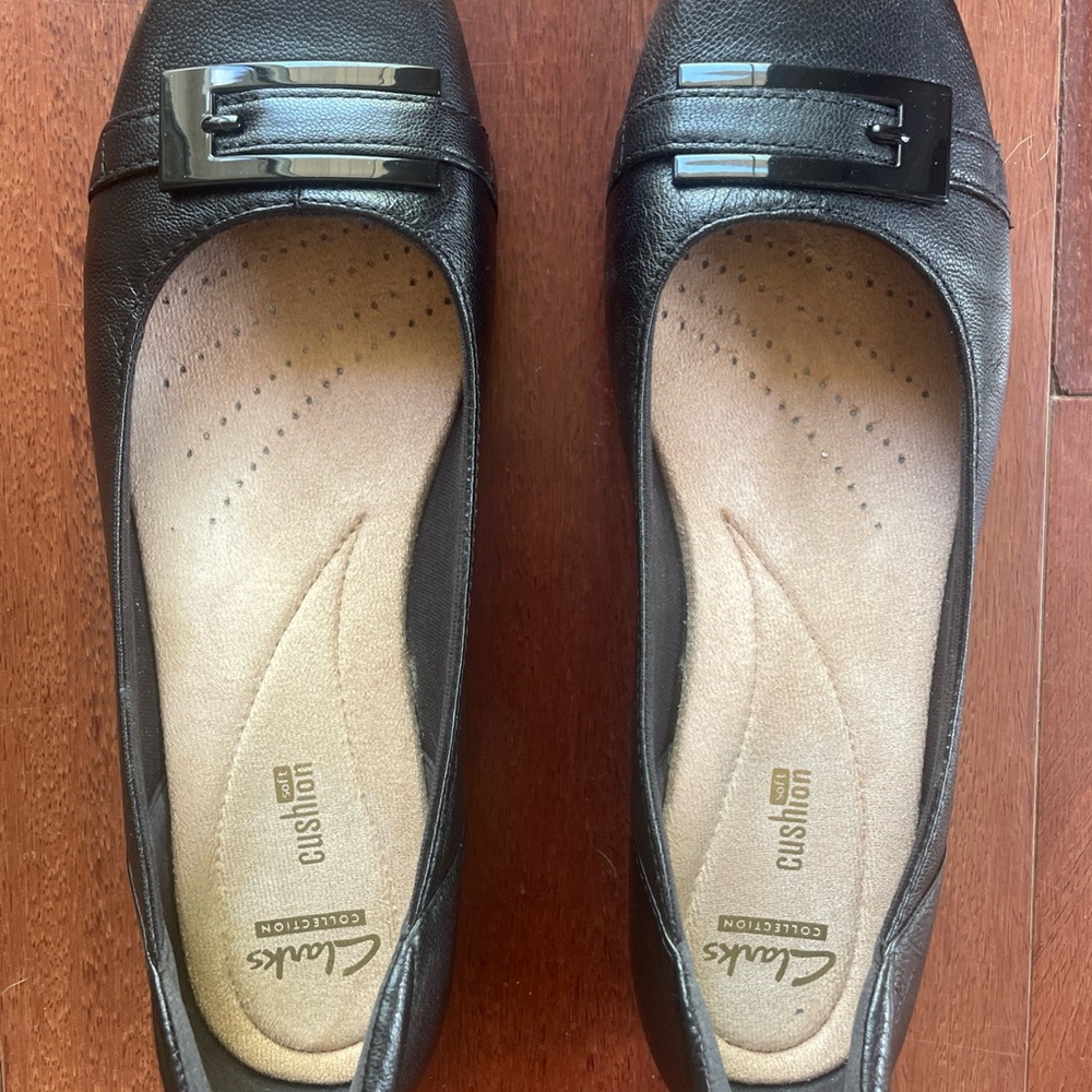Clarks Blanche West Black Flats with Decorative Buckle and Cushioned Insole